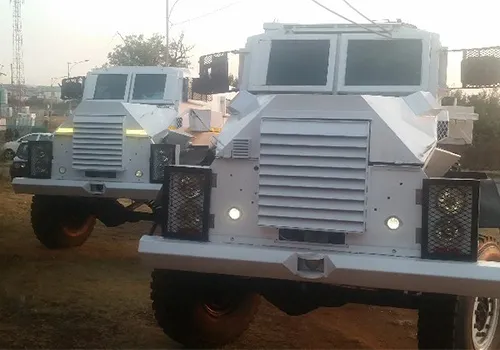 Two white Casspir armoured personnel carriers, seen from the front